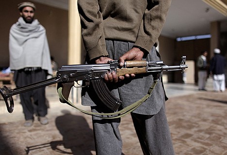 &lt;p&gt;A Pakistani militant holds his AK-47 while guarding the militia headquarters in Peshawar, Pakistan, on Dec. 9. Tribal militias allied with the government helped block a Taliban advance in this corner of northwest Pakistan close to the Afghan border, but their success has come at a price: the empowerment of untrained, unaccountable private armies that could yet emerge as a threat of their own.&lt;/p&gt;