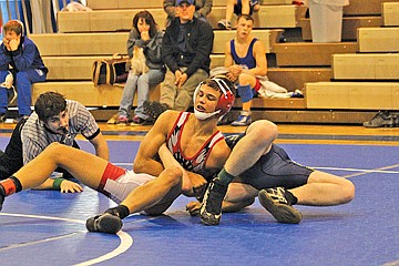 &lt;p class=&quot;p1&quot;&gt;Austin Rubel of Arlee applies pressure to his opponent in an attempt to get the pin.&lt;/p&gt;