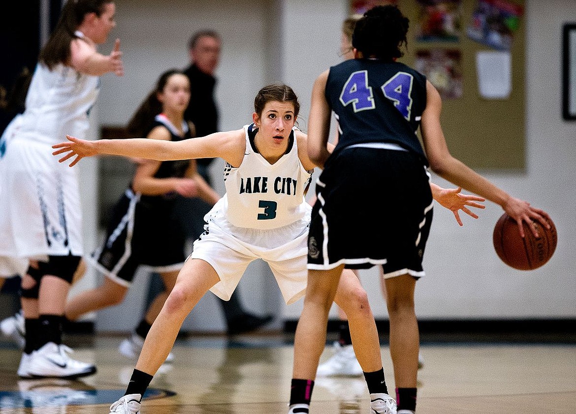 &lt;p&gt;JAKE PARRISH/Press Lake City's Nina Carlson (3) defends Lake Steven's Kylee Griffen during the first half on Monday at the 2015 Coeur d'Alene High School Women's Winter Classic tournament at Coeur d'Alene High School.&lt;/p&gt;