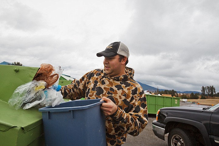 &lt;p&gt;SHAWN GUST/Press Nick Haas, of Coeur d'Alene, dumps his plastic sacks in a recycling bin Wednesday at the Solid Waste Department of Kootenai County transfer station. The department is planning to reduce the number of drop sites at local schools as a way of saving funding.&lt;/p&gt;