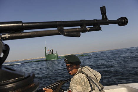 &lt;p&gt;Members of the Iran Navy participate in a drill Wednesday, Dec. 28, 2011 in the Sea of Oman. Iran's navy chief warned Wednesday that his country can easily close the strategic Strait of Hormuz at the mouth of the Persian Gulf, the passageway through which a sixth of the world's oil flows. The navy is in the midst of a 10-day drill in international waters near the strategic oil route. (AP Photo/International Iran Photo Agency, Ali Mohammadi)&lt;/p&gt;