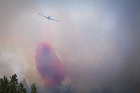 &lt;p&gt;A firefighting aircraft dumps retardant on a fire near Mica Bay estimated to be five acres in size near Doubletree Road on Tuesday, July 30, 2013.&lt;/p&gt;