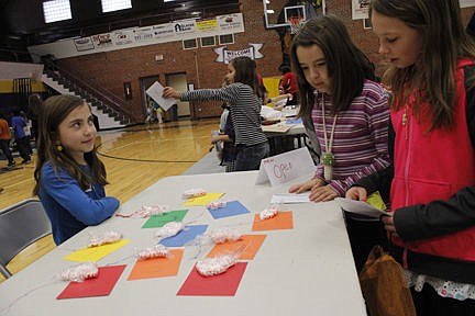 &lt;p&gt;Third graders Lourdes, center, and Alexis check out Aspen's cookie cutter-shaped peppermints during Linderman Elementary School's All-School Christmas Market on Thursday, Dec. 18. &quot;It sounded like fun so I decided to make them for market,&quot; Aspen said of her project. Vince Lovato / Leader photos Vince Lovato / Leader photo&lt;/p&gt;