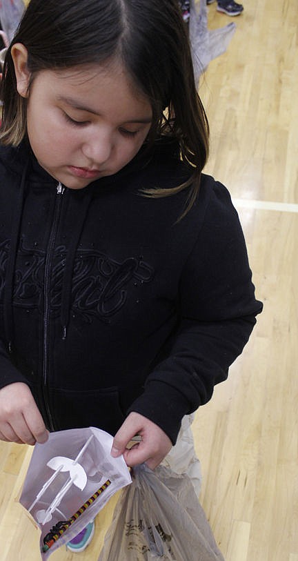 &lt;p&gt;Alexa, a third grader, shows off her reindeer inside a decorative bag Thursday, Dec. 18, during Linderman Elementary School's All-School Market. She was very moved by the purchase. She liked the market because, &quot;We get to buy stuff and it feels like being rewarded for being good.&quot; Vince Lovato / Leader photo&lt;/p&gt;