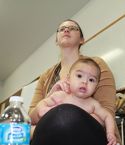 &lt;p&gt;Breanne applies a light rub to Asher's back Friday during the Lake County Public Health Department's monthly Parents as Teachers program. Licensed massage therapist Mary Gertson demonstrated hoiw to safely massage babies. Vince Lovato / Leader photo&lt;/p&gt;