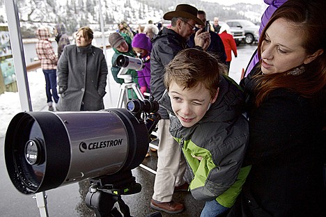 &lt;p&gt;Aazahn Funk, 8, tries to keep his eye on an eagle before looking through a spotting scope with the assistance of his mother Heather Huber-Funk at the Mineral Ridge boat launch Thursday on Lake Coeur d'Alene.&lt;/p&gt;