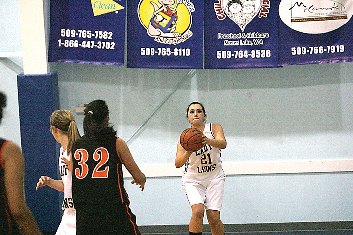 Improved outside shooting of Madison Yamane (21) was just one of the keys in last night's Moses Lake Christian Academy 80-40 win over Bridgeport.