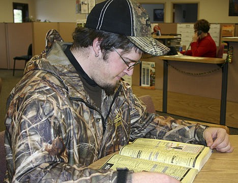 &lt;p&gt;Brian Fulton scans the yellow pages for a phone number to complete his application for assistance with the cost of the MSHA course, which he hopes will be his avenue out of unemployment.&lt;/p&gt;