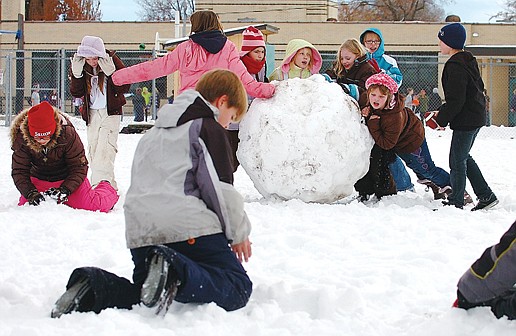 A group of students play in the snow during lunch recess at Russell Elementary School Wednesday afternoon. Kalispell&#146;s elementary and high school districts face a potential budget shortfall of $889,000 to $1.1 million in 2010-11. School district administrators and school board trustees will decide over the next few months how to handle the shortfall, whether by cutting programs or personnel, asking voters to approve an extra tax levy or both.