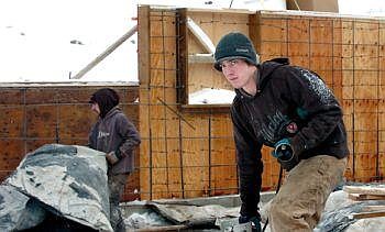 Travis Cik of Ron Terry Construction Inc. packs up tools Tuesday after working on a townhouse basement in the cold on Mountain Vista Way west of Kalispell. The crew had been unable to work for about a week because of the cold and snow. Ron Terry Construction, which deals primarily in affordable housing, sold about 20 homes in 2008, compared to 40 in 2007. Karen Nichols/Daily Inter Lake