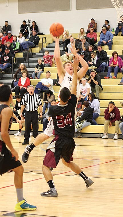 Teddy Mead of Royal goes over a Wahluke defender in an attempt for two points.