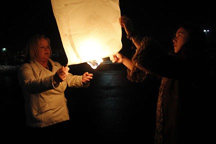 &lt;p&gt;Ronan ASB Advisor Bonnie Eva, left, and ASB member Jessie Lewis release a lantern during the third annual Ronan Remembrance on Thursday, Dec. 18 at Ronan High School. More than 90 people donated $5 to set aloft a lantern to remember loved ones who can't be here for the holidays. The Ronan High School Student Council sponsored the event and collected more than $500, said advisor Bonnie Eva. Vince Lovato / Leader photo&lt;/p&gt;