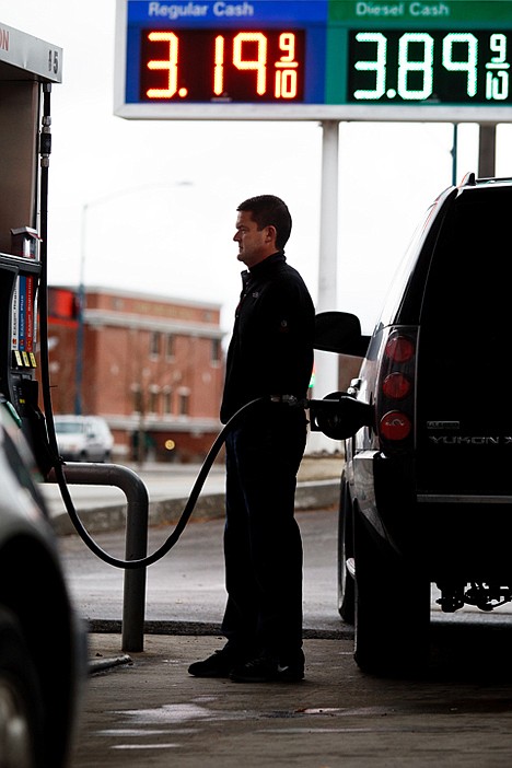 &lt;p&gt;Jeff Kendrick waits as he fills his tank with gasoline Wednesday in Coeur d'Alene. Average fuel prices in the city are $3.11 per gallon according to the American Automible Association.&lt;/p&gt;