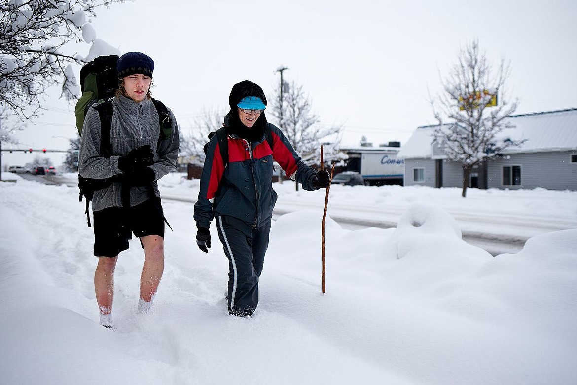 &lt;p&gt;Rene Hall walks with her son, Kyler Scott, along a snow-laden sidewalk on Tuesday on Bosanko Avenue in Coeur d'Alene. Hall and Scott, who do not drive cars, often find the sidewalks they walk on not shoveled, making commutes for pedestrians more difficult. For most sidewalks, it is up to the businesses near them to clear them of snow.&lt;/p&gt;