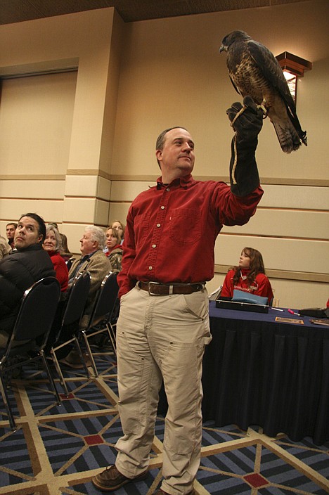 &lt;p&gt;Justin Roscoe, a veterinarian with Birds of Prey Northwest, shows off a Swainson's hawk at the Coeur d'Alene Resort convention center on Sunday.&lt;/p&gt;