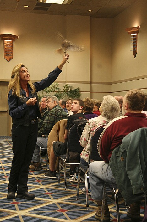 &lt;p&gt;During a presentation on Sunday at The Coeur d'Alene Resort convention center, Jane Fink, a raptor biologist with Birds of Prey Northwest, shows an American Kestrel to the audience.&lt;/p&gt;