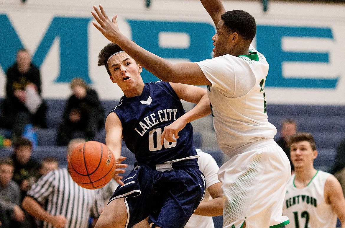 &lt;p&gt;JAKE PARRISH/Press Lake City's Kenneth Louie-McGee gets a low pass off around Kentwood's Eli'Sha Sheppard during the second half of a face-off on Tuesday at the Lake City Invitational at Lake City High School.&lt;/p&gt;