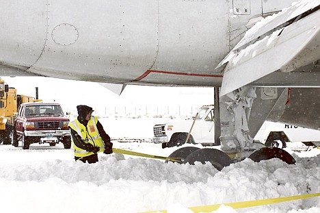 &lt;p&gt;Crews work to dig out an American Airlines 757 airplane Wednesday at Jackson Hole Airport. Airline spokesman Ed Martelle said Flight 2253 from Chicago &quot;had a long rollout&quot; when it landed at 11:37 a.m. Wednesday. The plane came to rest on a hard surface and did not go off into grass of brush, he said.&lt;/p&gt;