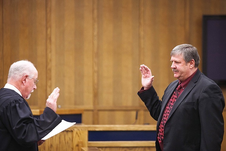 &lt;p&gt;Judge Ted Lympus, left, swears in Gary Krueger as Flathead County commissioner Monday morning at the Flathead County Justice Center. &#160;&lt;/p&gt;