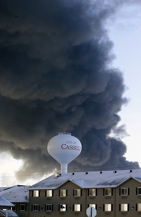 <p>A fireball goes up at the site of an oil train derailment Monday in Casselton, N.D.</p>