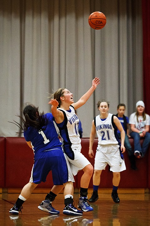 &lt;p&gt;Coeur d'Alene's Kyeli Parker gets position on Feral Way High School's Darah Huertes-Vining (1) after knocking the ball loose Thursday in the first half of the girls championship game of the Holiday Inn Express Invitational Tournament at North Idaho College.&lt;/p&gt;