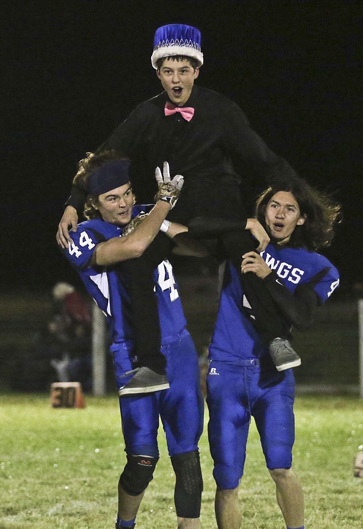 &lt;p&gt;Kylie Richter/ Lake County Leader Mission's Billy von Holtum and Nick Durglo hold up homecoming king Nathan Doll after he received his crown.&lt;/p&gt;