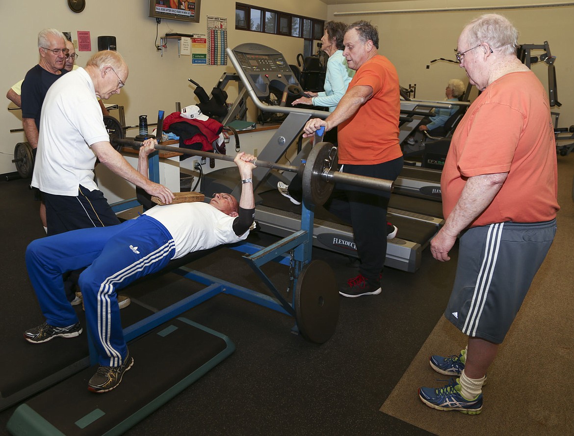 &lt;p&gt;Skip Schacher lifts while others look on.&lt;/p&gt;