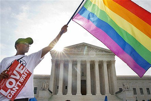 &lt;p&gt;Carlos McKnight of Washington waves a flag in support of gay marriage outside the Supreme Court in Washington on Friday. (AP Photo/Jacquelyn Martin)&lt;/p&gt;