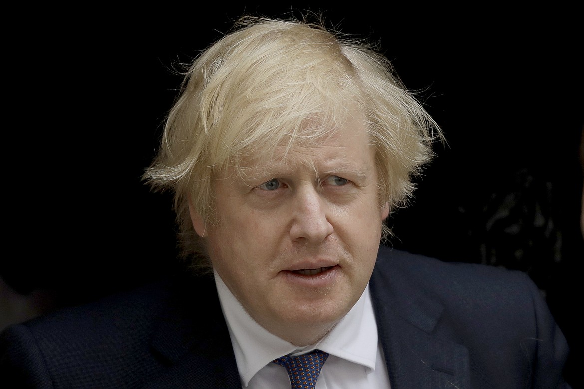 British Prime Minister Boris Johnson leaves 10 Downing Street in London, to attend the weekly Prime Minister's Questions at the Houses of Parliament, in London, Wednesday, July 1, 2020. (AP Photo/Matt Dunham)