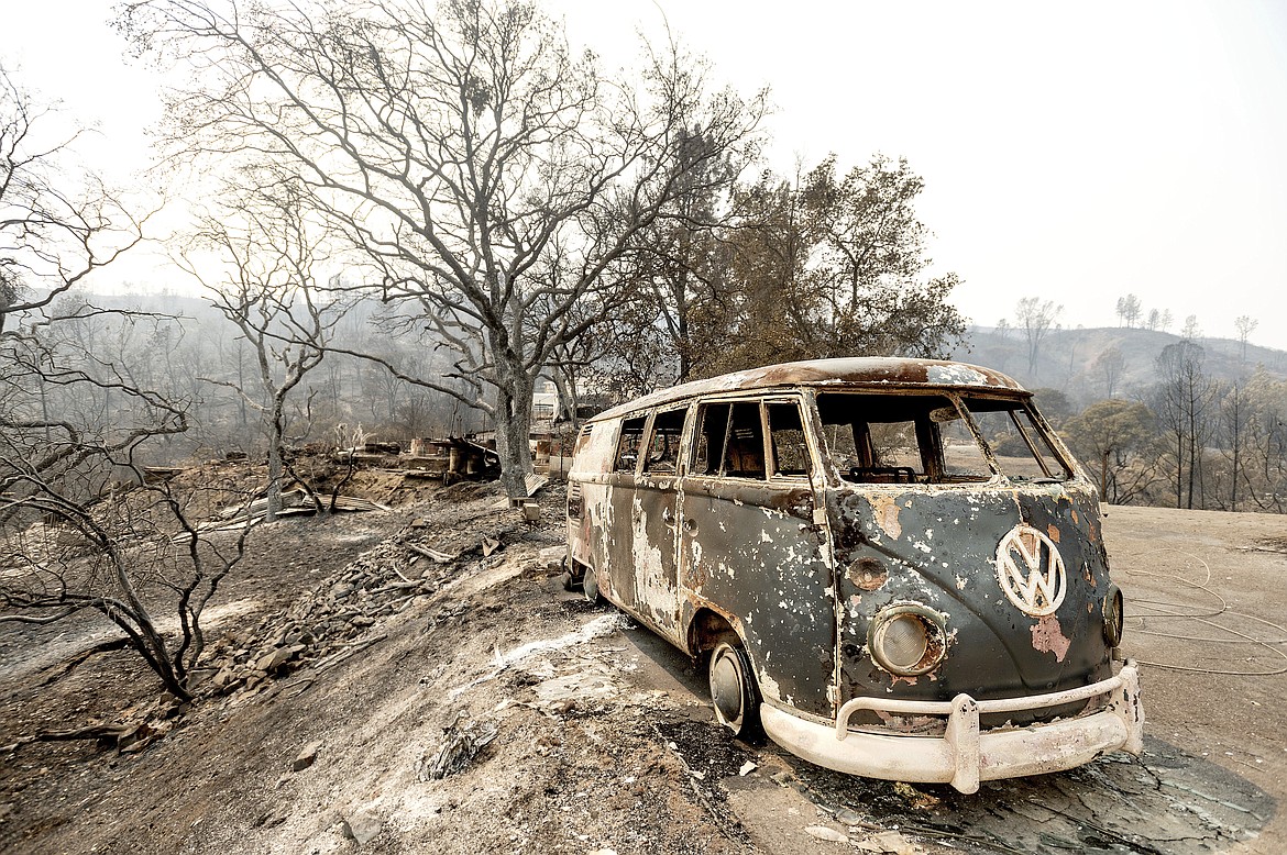 Following the LNU Lightning Complex fires, a scorched VW Microbus rests in a driveway of the Spanish Flat community in Napa County, Calif., on Monday, Aug. 24, 2020. (AP Photo/Noah Berger)