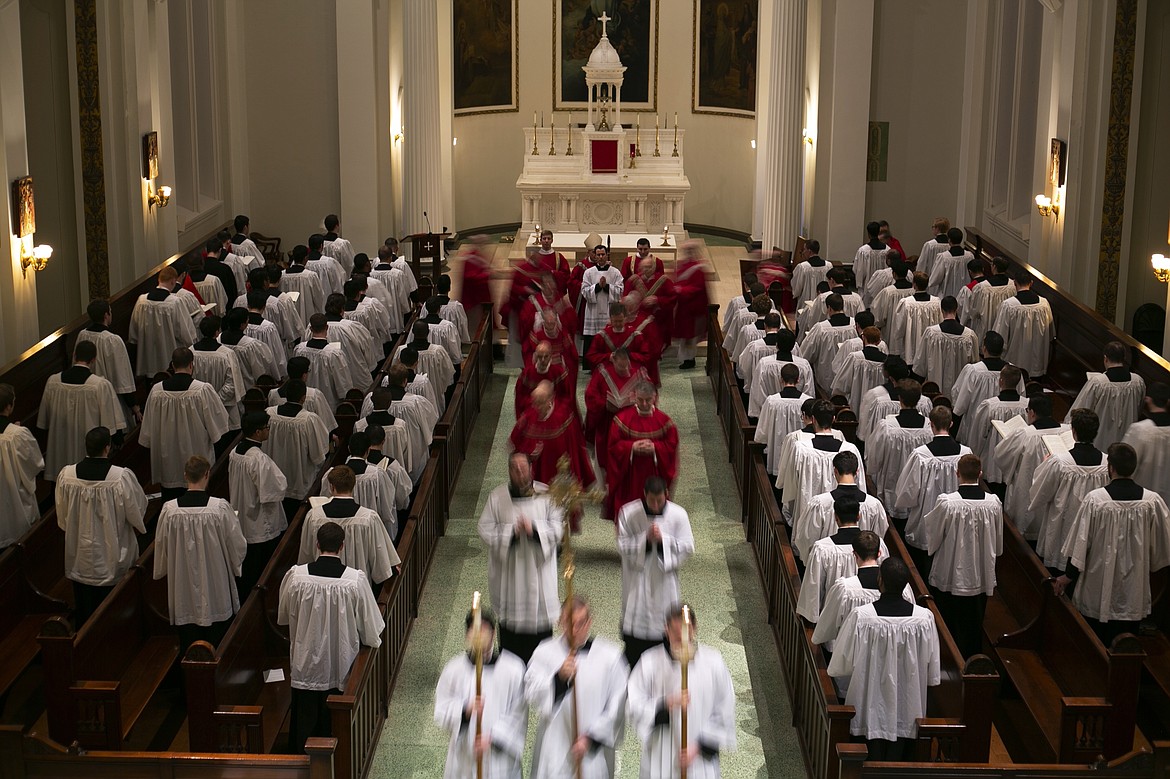 ADVANCE FOR SUNDAY, FEB 16 - Seminarians and faculty file out from Mass at St. Charles Borromeo Seminary in Wynnewood, Pa., on Wednesday, Feb. 5, 2020. After the sexual abuse crisis in the Catholic Church, seminaries say they have tightened screening of applicants. (AP Photo/Wong Maye-E)