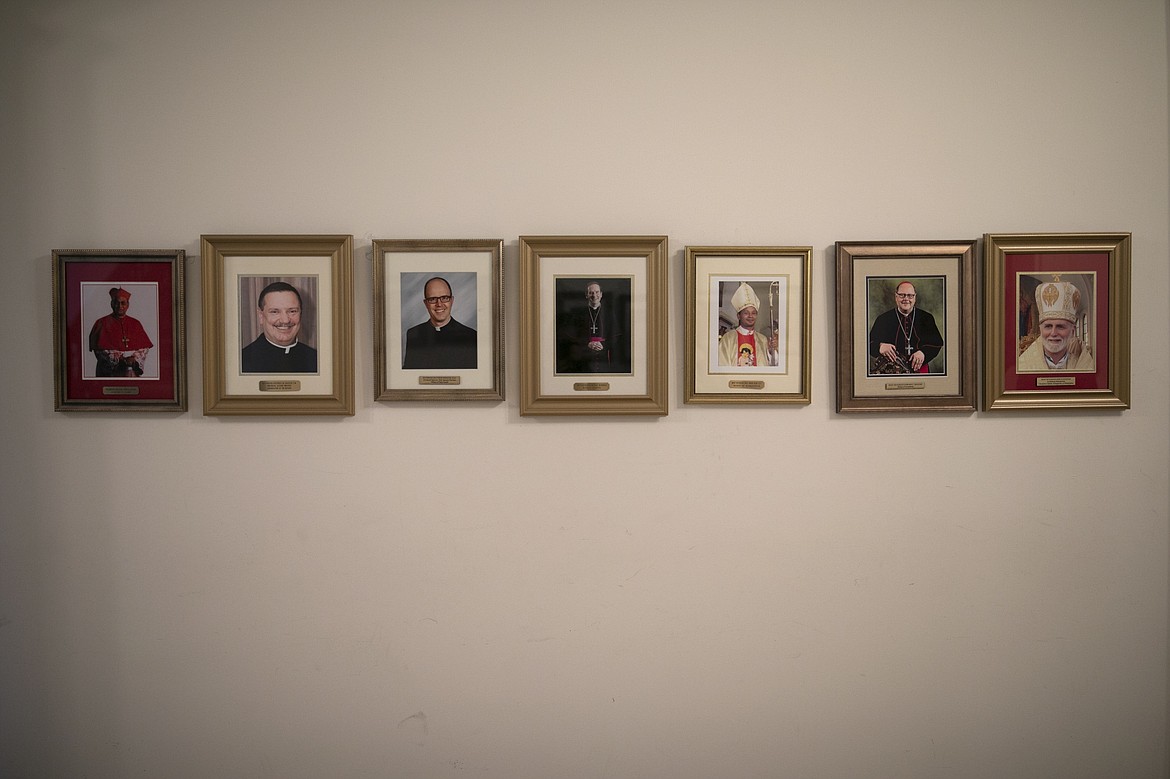 ADVANCE FOR SUNDAY, FEB 16 - Photos of bishops and leaders of religious orders line a hallway at St. Charles Borromeo Seminary in Wynnewood, Pa., on Wednesday, Feb. 5, 2020. The 156 men at the seminary come from dioceses and religious orders across the U.S. and as far away as Sri Lanka. (AP Photo/Wong Maye-E)