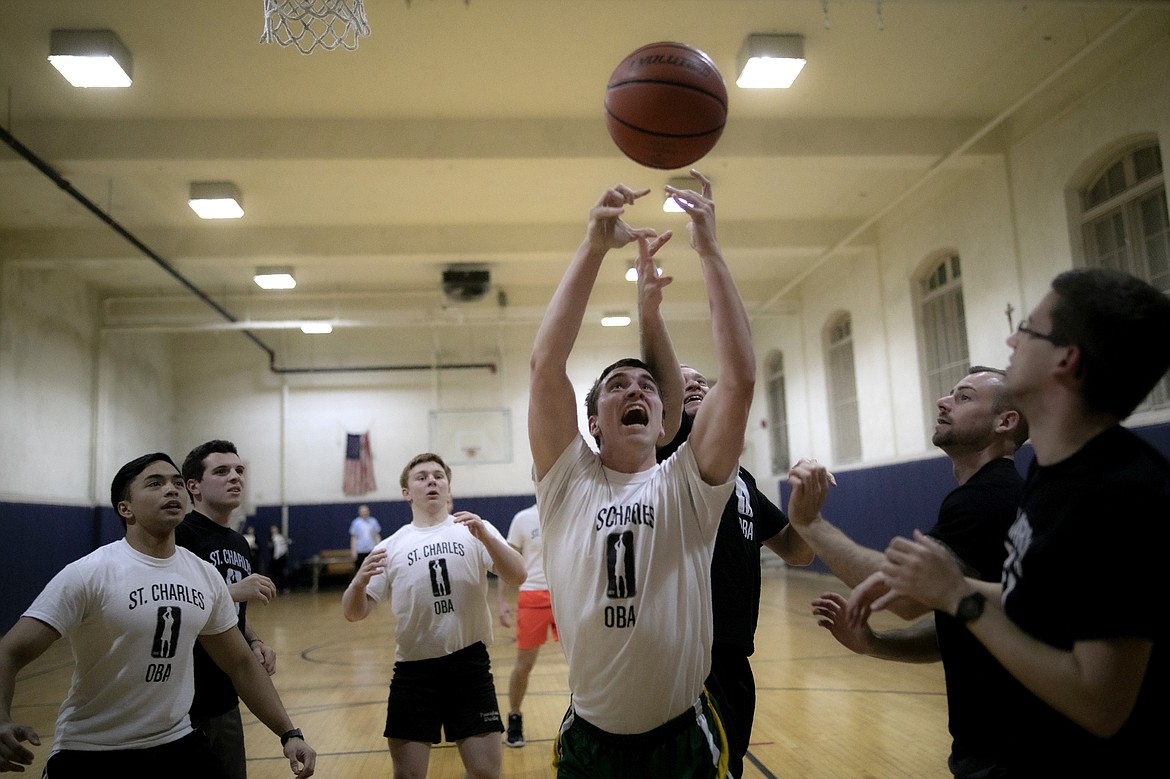 ADVANCE FOR SUNDAY, FEB 16 - Seminarian John Paul Heisler plays basketball at St. Charles Borromeo Seminary in Wynnewood, Pa., on Wednesday, Feb. 5, 2020. Seminary students are working toward ordination as Catholic priests and speak of their classmates as "brothers." (AP Photo/Wong Maye-E)