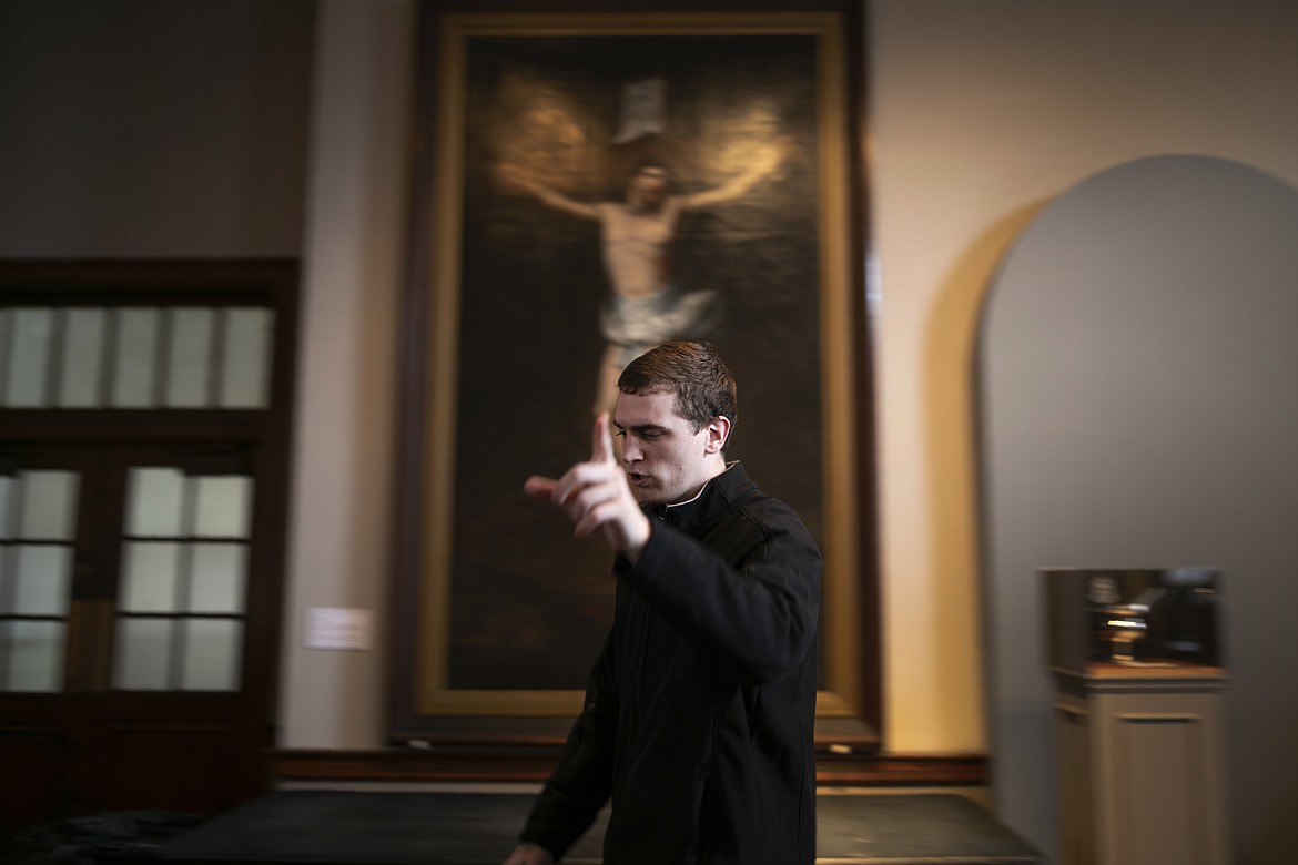 ADVANCE FOR SUNDAY, FEB 16 - Seminarian John Paul Heisler gestures while walking through St. Charles Seminary in Wynnewood, Pa., on Wednesday, Feb. 5, 2020. The 188-year-old seminary is dotted with paintings of Bible scenes and reminders of papal visits. (AP Photo/Wong Maye-E)