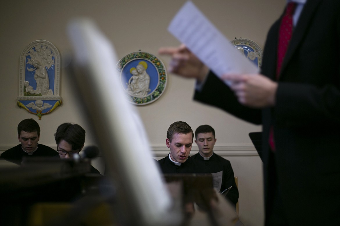 ADVANCE FOR SUNDAY, FEB 16 - Seminarian Daniel Rice, third from left, sings with a choir at St. Charles Borromeo Seminary in Wynnewood, Pa., on Wednesday, Feb. 5, 2020. Men pursuing ordination to the Catholic priesthood come to the seminary from dioceses and religious orders around the world. (AP Photo/Wong Maye-E)