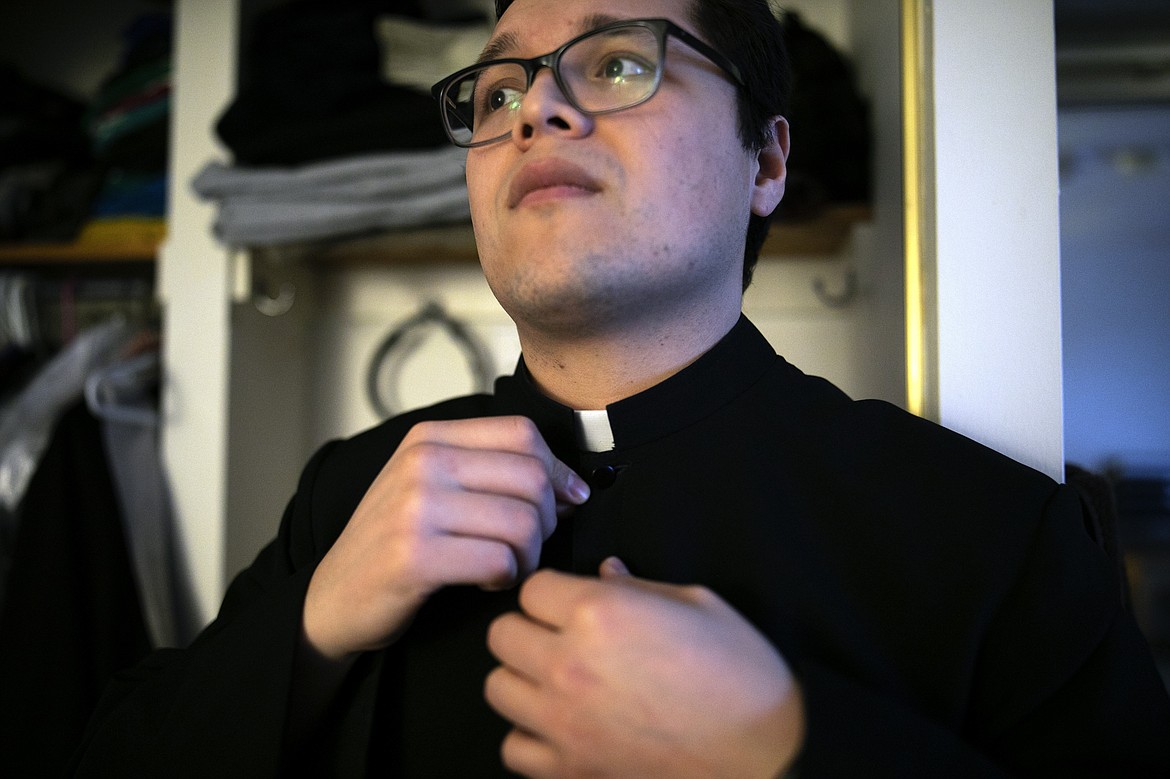 ADVANCE FOR SUNDAY, FEB 16 - Seminarian Emmanuel Carreno prepares for Mass at St. Charles Borromeo Seminary in Wynnewood, Pa., on Wednesday, Feb. 5, 2020. Students at the seminary are preparing to enter ministry at a time of unprecedented shake-up in the Catholic Church. (AP Photo/Wong Maye-E)