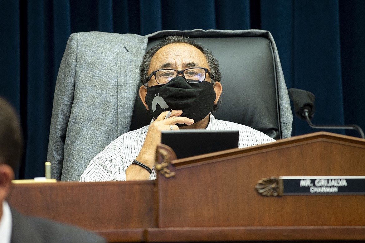 FILE - In this June 29, 2020 file photo, Committee Chairman Rep. Raul Grijalva, D-Ariz., listens on Capitol Hill in Washington, during the House Natural Resources Committee hearing.  A bipartisan bill that would spend nearly $3 billion on conservation projects, outdoor recreation and maintenance of national parks and other public lands is on its way to the president’s desk after winning final legislative approval. Supporters say the measure, known as the Great American Outdoors Act, would be the most significant conservation legislation enacted in nearly 50 years.  (Bonnie Cash/Pool via AP)