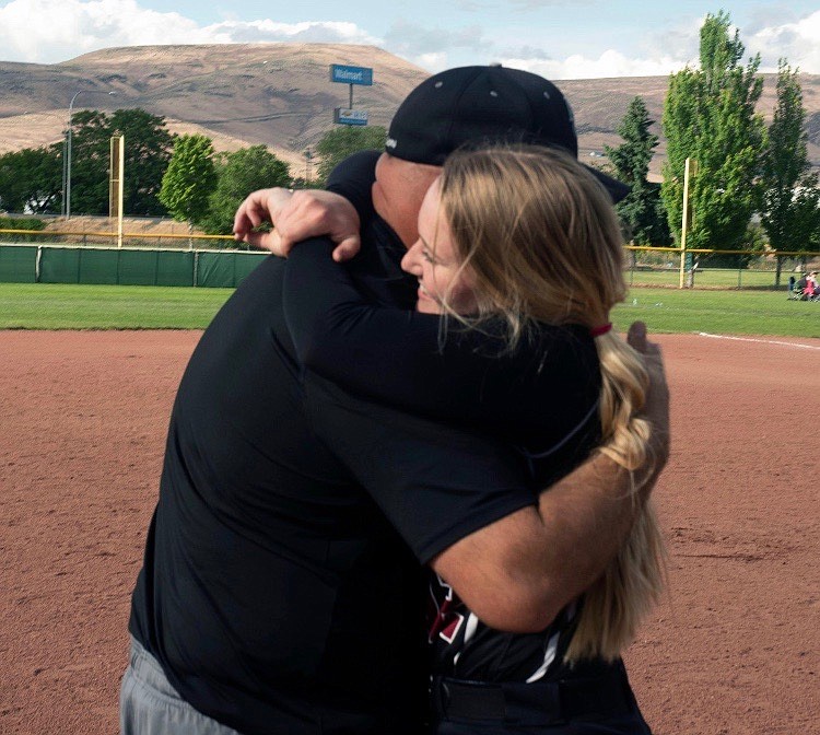 Courtesy photo
ACH senior Kendel Correia shares a hug with her dad, ACH head baseball coach Mike Correia.