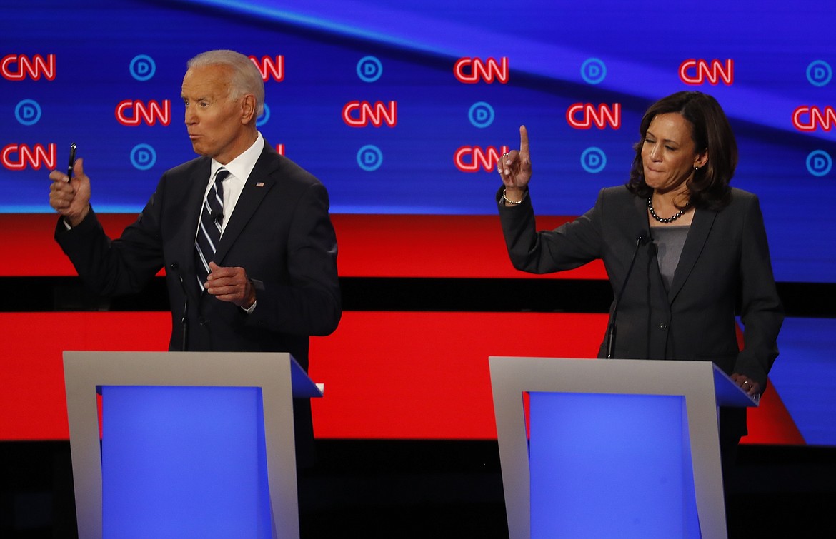 FILE - In this July 31, 2019, file photo, then-Democratic presidential candidate Sen. Kamala Harris, D-Calif., and Democratic presidential candidate former Vice President Joe Biden participate in the second of two Democratic presidential primary debates at the Fox Theatre in Detroit. Biden has chosen  Harris as his running mate. (AP Photo/Paul Sancya, File)