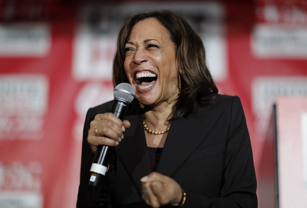 FILE - In this Nov. 8, 2019, file photo, then-Democratic presidential candidate Sen. Kamala Harris, D-Calif., reacts as she speaks at a town hall event at the Culinary Workers Union in Las Vegas. Democratic presidential candidate former Vice President Joe Biden has chosen  Harris as his running mate. (AP Photo/John Locher, File)