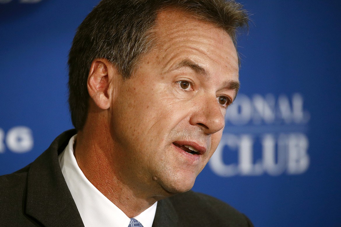 FILE - In this Aug. 7, 2019, file photo, Democratic Montana Gov. Steve Bullock speaks at the National Press Club in Washington. Montana voters on Tuesday, June 2, 2020, are choosing party nominees for governor, U.S. Senate and House and a slate of other offices in a primary election that was changed to all-mail balloting to protect against the spread of the coronavirus. Republicans are seeking to end 16 consecutive years with a Democrat in the governor’s office when Bullock completes his second term. (AP Photo/Patrick Semansky, File)