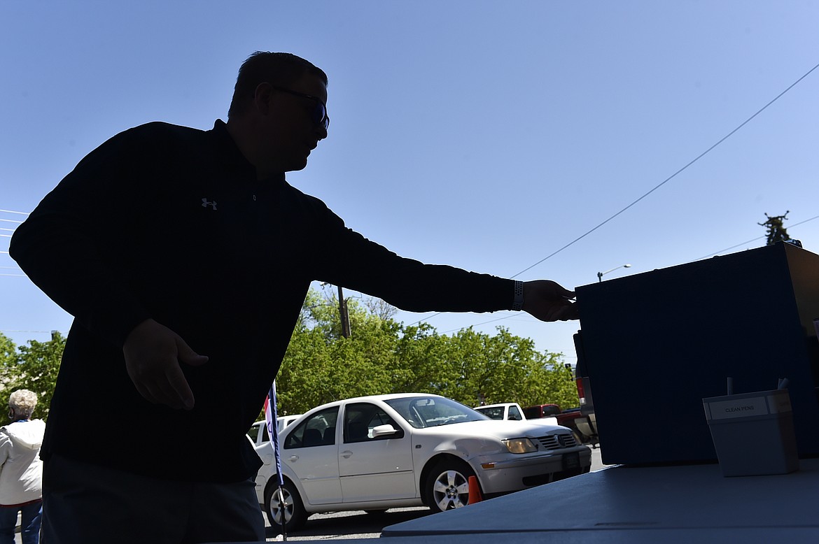 Voters drop off their ballots Tuesday outside the City-County Building during Montana's primary election Tuesday, June 2, 2020 in the City-County Building Tuesday in Helena. Montana’s June 2 primary is being held by mail because of the coronavirus.  (Thom Bridge/Independent Record via AP)