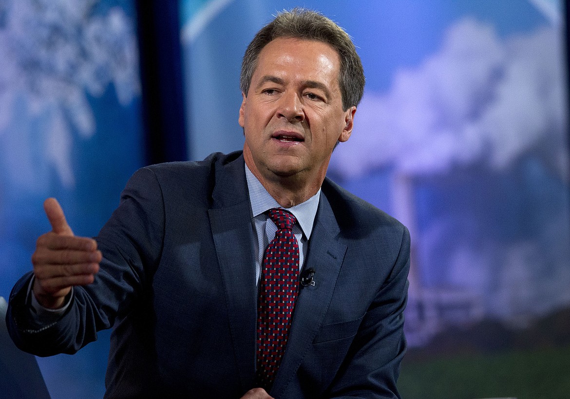 In this Sept. 20, 2019, file photo, Montana Gov. Steve Bullock speaks at Georgetown University in Washington. Incumbent Republican U.S. Sen. Steve Daines faces off Saturday, Aug. 8, 2020, in the first of three debates against his Democratic opponent, Montana Gov. Steve Bullock, in a race that is among the GOP-held seats in states won by President Trump in 2016 that Democrats think they have a chance to flip in November. (AP Photo/Jose Luis Magana, File)