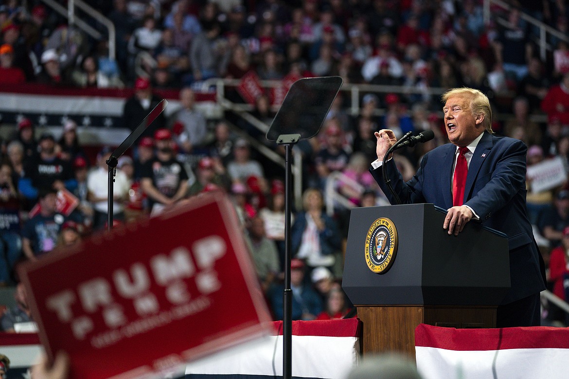 FILE - In this March 2, 2020, file photo President Donald Trump speaks during a campaign rally at Bojangles Coliseum in Charlotte, N.C. Confronting a pandemic that has upended his presidency and threatened his reelection prospects, Trump has focused almost exclusively on tending to his base. (AP Photo/Evan Vucci, File)