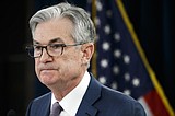 Fed to keep buying bonds and sees no rate hike through 2022