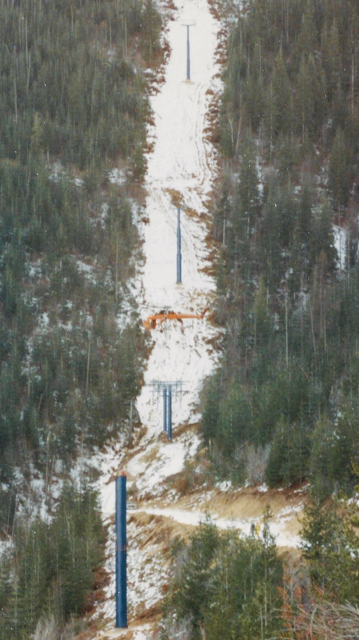Courtesy photo/ As the path up the hillside was cut, pylons were placed after their concrete form foundations were poured, set, and then moved into place via helicopter.