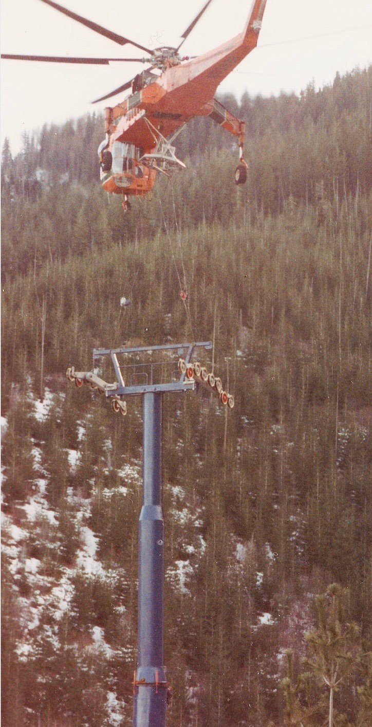 Courtesy photo/ An Erickson Air Crane lowers a piece of one of the aerial pylons into place to be connected during the construction of the gondola.