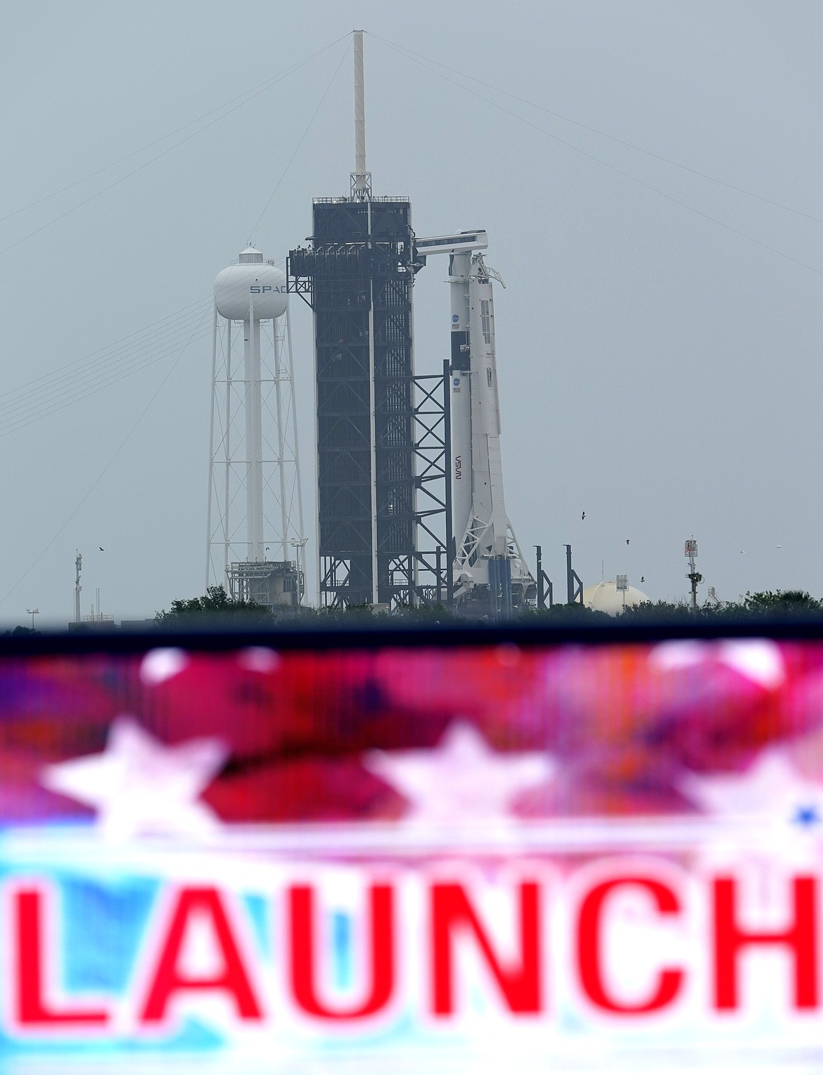 The SpaceX Falcon 9, with the Crew Dragon spacecraft on top of the rocket, sits on Launch Pad 39-A Monday, May 25, 2020, at Kennedy Space Center, Fla. Two astronauts will fly on the SpaceX Demo-2 mission to the International Space Station scheduled for launch on May 27. (AP Photo/David J. Phillip)
