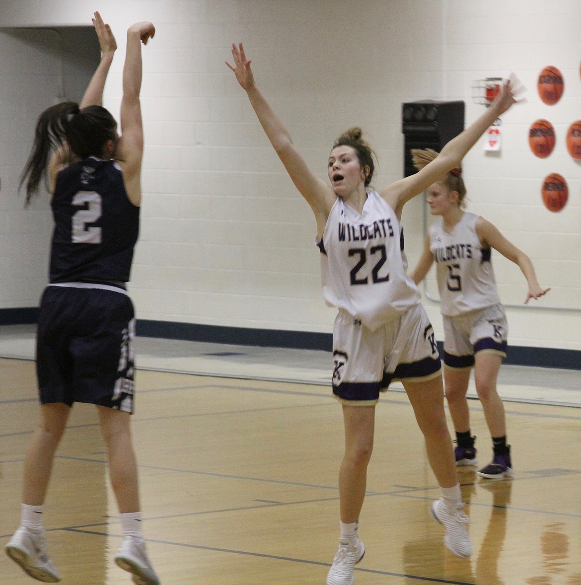 Photo by AriAna McDonald/ Hailey Cheney closes out on a Bonners Ferry shooter during the opening round of the 3A District 1 Tournament.