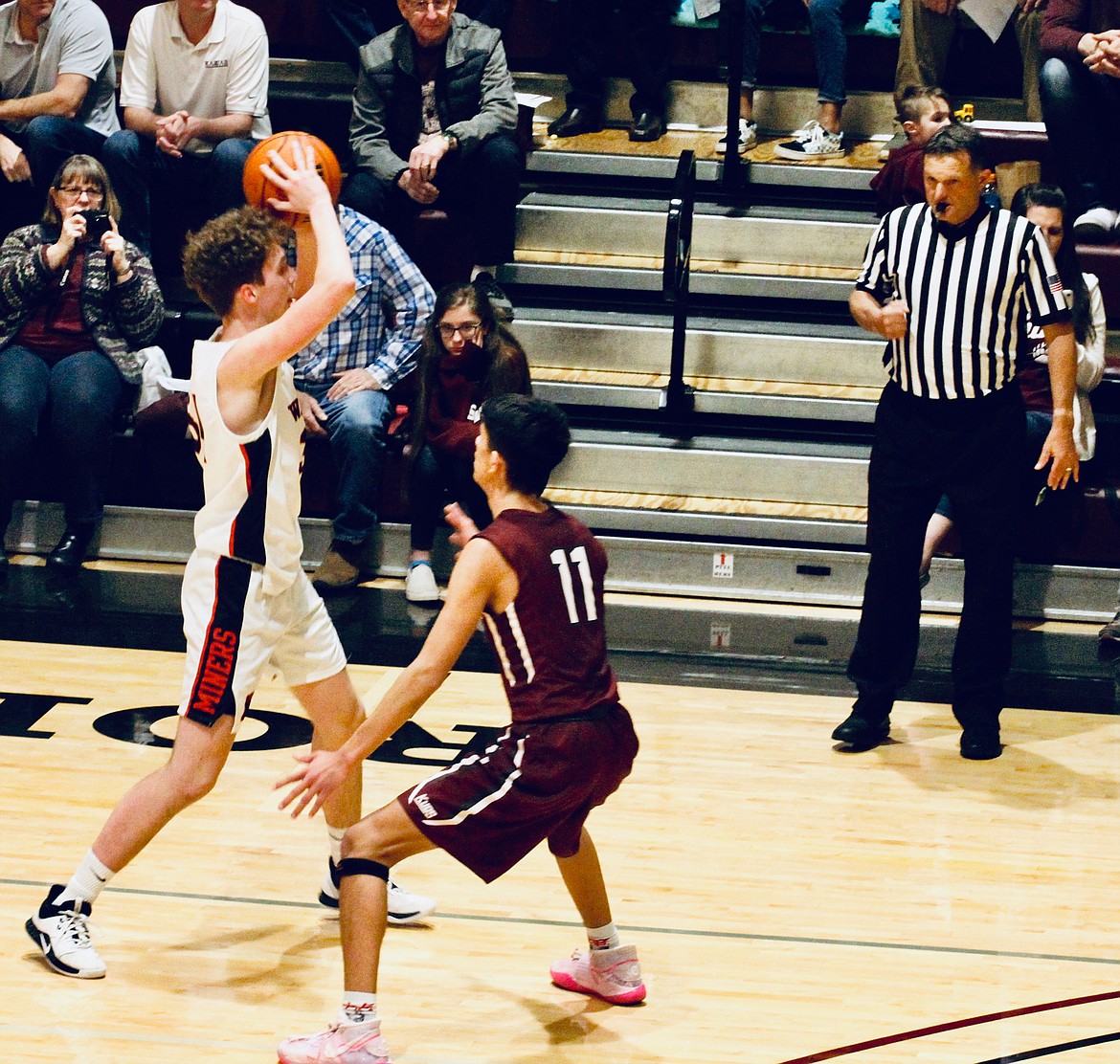 Wallace’s Conner Denson (white jersey) keeps the ball away from a Kamiah defender during the Miners season-ending loss to the Kubs at North Idaho College.
